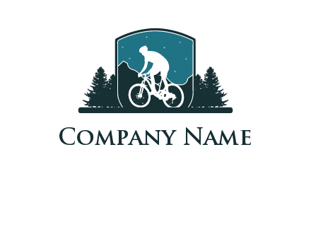 mountain biking in shield with trees emblem logo